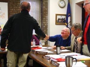Ben Kleppinger/ben.kleppinger@amnews.com Boyle County Jailer Barry Harmon, left, shakes hands with Magistrate Donnie Coffman Tuesday as he thanks the Boyle County Fiscal Court for approving a contract with Shepherd's House for a drug treatment program.