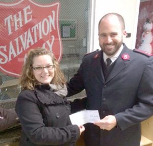 Salvation Army Captain Patrick Richmond (right) being presented the Inmate Veterans Club donation by Northpoint Training Center Classification and Treatment Officer Christian Toelke.