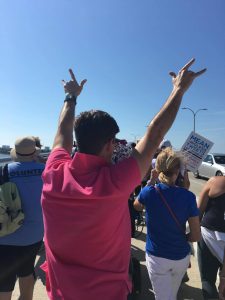 Kelly Miller, photographed by partner Tim Robbins, both formerly of Danville, take to the streets for a sister march in Sarasota, Florida. 
