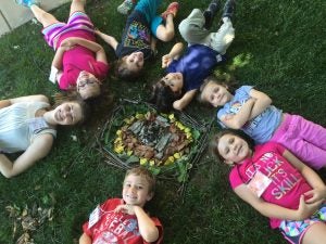 Campers during the “Art Around the World” art camp this summer created their own outdoor sculptures using found objects. 