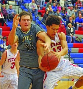 Will Bramel, left, of Boyle County and Aaron Johnson of Mercer County battle for a rebound during the second quarter of Boyle’s 78-76 victory Tuesday. 