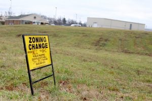 Ben Kleppinger/ben.kleppinger@amnews.com  |   A sign at 109 War Admiral Road announces the plan for a zone change that would allow Party On Air to expand. Visible across the property in the back right is the back of Party On Air.