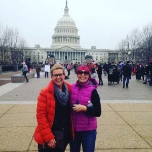 Callie Minks, right, and friend stand in Washington, D.C. during the Women's March. 