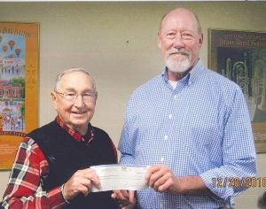 Pioneer Vocational Industrial Services Inc.: Rey Schaefer presents a $400 check to Mike Pittman, executive director of pioneer Vocational Industrial Services. Pioneer is a not for profit organization that has provided services to individuals with disabilities in the community since 1967.