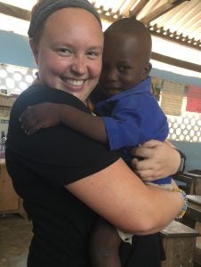 Photo submitted |  Centre College student Madison Grant holds a little boy named Henry who became her friend while she was in Ghana.